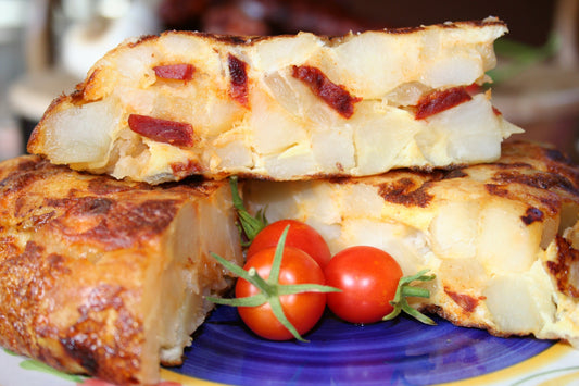 Slices of Spanish Tortilla with Chorizo on a Tapas Plate