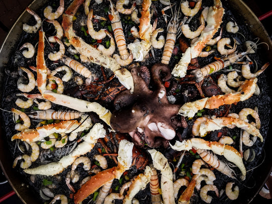 Large Paella Pan of Black Squid Ink Paella with Shrimp, Calamari & Crab Legs